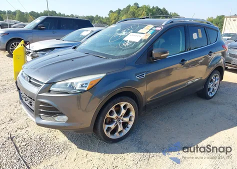 2016 Ford Escape Titanium z USA, uszkodzony, nr VIN 1FMCU9J97GUC20513